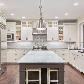 Coastal Bay Construction - a large kitchen with white cabinets and stainless steel appliances - General Contractors Near Me - Delmar, Delaware Coastal Bay Construction - a large kitchen with white cabinets and stainless steel appliances - General Contractors Near Me - Delmar, Delaware