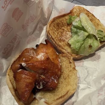 Crispy Burger - Is overcook chicken burger a size of a small hand not very big - Chicken Shop Near Me - Queens, New York
