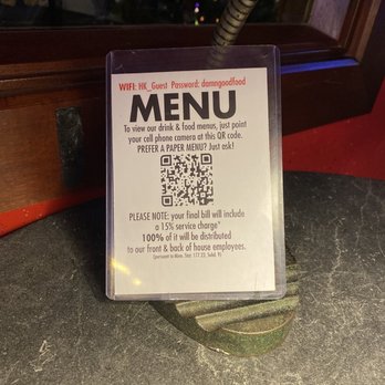Hell's Kitchen - The notification sign at our table which show they only charge 15% service fee - New American Near Me - Minneapolis, Minnesota