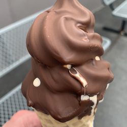 Holy Cow! Creamery - Orange Soft Serve Dipped in Chocolate in a Waffle Cone!
