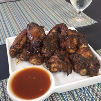 Flavaz Jamaican grille - Jerk Wings. They came out barely lukewarm, but they tasted so good, I didn't bother sending them back. - Caribbean Near Me - Riverview, Florida