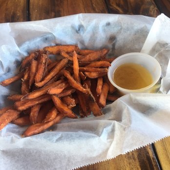 Outriggers Bar and Grill - Sweet potato fries with honey on the side - Bars Near Me - Micco, Florida Outriggers Bar and Grill - Sweet potato fries with honey on the side - Bars Near Me - Micco, Florida