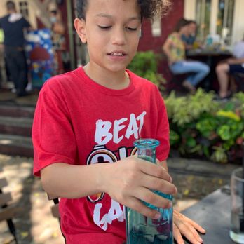 Dada - He was fascinated by the water jar. - New American Near Me - Delray Beach, Florida