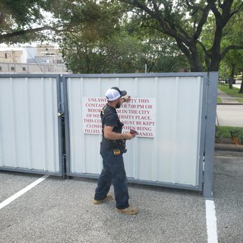 365 Maintenance - a man standing in a parking lot - Handyman Near Me