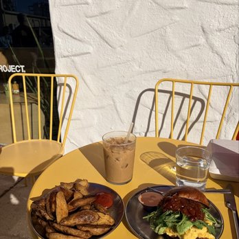 Project Coffee - Iced latte, breakfast sandwich, home fries - Coffee & Tea Near Me - Sarasota, Florida Project Coffee - Iced latte, breakfast sandwich, home fries - Coffee & Tea Near Me - Sarasota, Florida