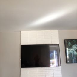 Mounted over brick fireplace with concealed cables