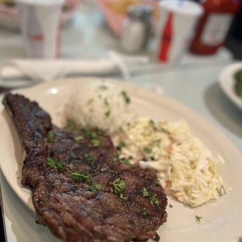 Islander Bar and Grill - Bone in Rib Eye Steak w 2 sides: cole slaw and rice. It's good. $38.95 - Bars Near Me - Miami, Florida Islander Bar and Grill - Bone in Rib Eye Steak w 2 sides: cole slaw and rice. It's good. $38.95 - Bars Near Me - Miami, Florida