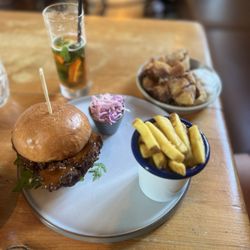The Connaught - Crispy chicken thigh burger with fries and smashed crispy potatoes and a Pimm's