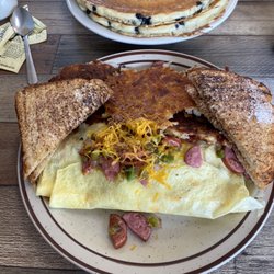 Our Place Cafe - 2 Blueberry pancakes and the Kielbasa Omelette with hash browns.