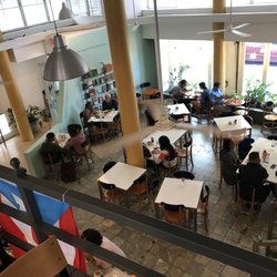 Cafe Paraiso - Free library up against the wall