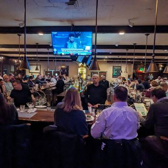 The Stockyard Restaurant - a large group of people sitting at a bar - Bars Near Me - Brighton, Massachusetts