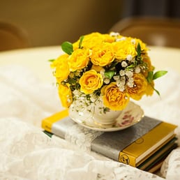 Tea cup floral arrangement for Tea time theme wedding Tea cup floral arrangement for Tea time theme wedding