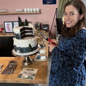 Cain's Creative Cakes - a woman cutting a cake - Custom Cakes Near Me - Denver, Colorado Cain's Creative Cakes - a woman cutting a cake - Custom Cakes Near Me - Denver, Colorado