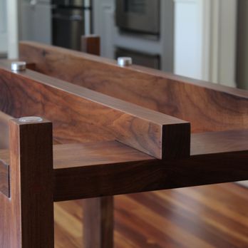 Turner & Associates - Custom walnut dining table with custom machined aluminum mounts - Cabinetry Near Me - Saint Louis, Missouri Turner & Associates - Custom walnut dining table with custom machined aluminum mounts - Cabinetry Near Me - Saint Louis, Missouri