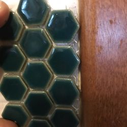 RBC Tile & Stone - Tile sample next to wood cabinet choice