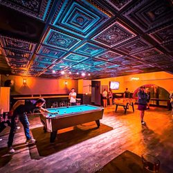 Pour Taproom - Wilmington - A shot of some costumers enjoying some games in the game room.