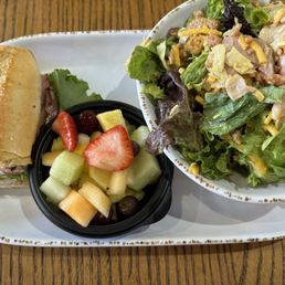 Half of The Ultimate Salad, Newk's Club Sandwich, and bowl of fruit!