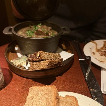 The Church - Lamb stew with Guinness in the bread, as well as the brown bread and butter in the foreground - Bars Near Me - Dublin, D The Church - Lamb stew with Guinness in the bread, as well as the brown bread and butter in the foreground - Bars Near Me - Dublin, D