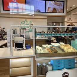 a counter with a variety of baked goods a counter with a variety of baked goods