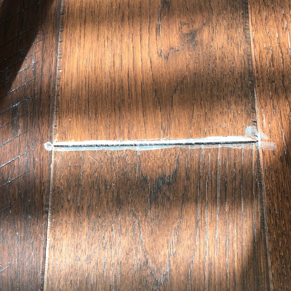 All Flooring USA - Gaps filled with black caulk that looks absolutely terrible when the light hits it. - General Contractors Near Me - Orlando, Florida All Flooring USA - Gaps filled with black caulk that looks absolutely terrible when the light hits it. - General Contractors Near Me - Orlando, Florida