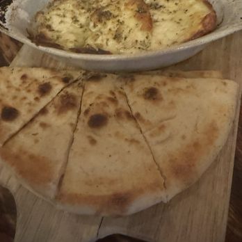 Santiago's Bodega - For the cheese lovers.  They set it on fire.  I wasn't a fan.  It was goat cheese + some other cheese.  One of the better deals here. - Tapas Bars Near Me - Orlando, Florida
