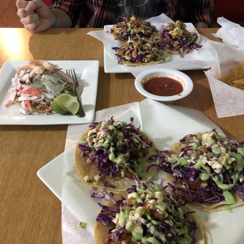 Mariscos Los Koras - Fish tacos (foreground), octopus tacos (background), and mixta tostada - Seafood Near Me - Greensboro, North Carolina Mariscos Los Koras - Fish tacos (foreground), octopus tacos (background), and mixta tostada - Seafood Near Me - Greensboro, North Carolina