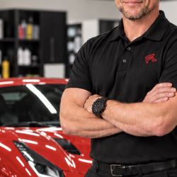 Fast Lane Window Tint & Protection Films - Jonathan Fondell, owner of Fast Lane Window Tint & Protection Films in Scottsdale, at the shop with a red Ferrari.