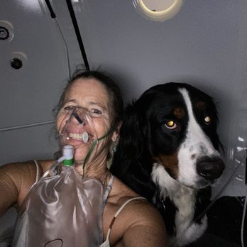 Chiropractic Connection Wellness Center - Dr Dana enjoying a hyperbaric oxygen treatment with her dog, Sunshine. - Acupuncture Near Me - San Diego, California Chiropractic Connection Wellness Center - Dr Dana enjoying a hyperbaric oxygen treatment with her dog, Sunshine. - Acupuncture Near Me - San Diego, California