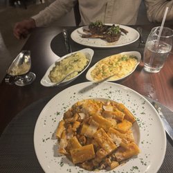Chicken rigatoni with spicy vodka sauce, Mashed potatoes, macaroni and cheese and lamb chops.