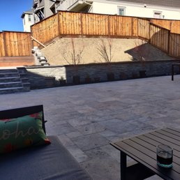 After, all travertine and beautiful fascia. Our choice low maintenance. We just need to add the plants now