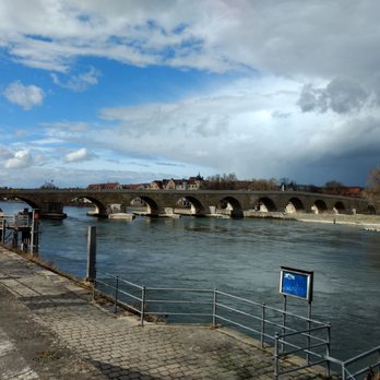 Steinerne Brücke - A view from the southern shore of the Danube with Brückturm on the left - Landmarks & Historical Buildings Near Me - Regensburg, BY