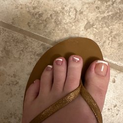 Crooked polish... no pink or white polish, just clear topcoat over white line.