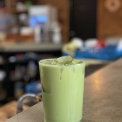 Hidden House Coffee - Iced matcha latte with oat milk and pistachio syrup
