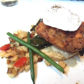 Canoe - Split Portion: Crispy Smoked Chicken Biscuit (Southern Collards, Poached Eggs, Red Eye Gravy, $14) - New American Near Me - Atlanta, Georgia