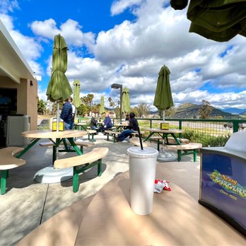 Nessy Burgers - Outdoor seating with umbrellas for shade. - Burgers Near Me - Fallbrook, California Nessy Burgers - Outdoor seating with umbrellas for shade. - Burgers Near Me - Fallbrook, California