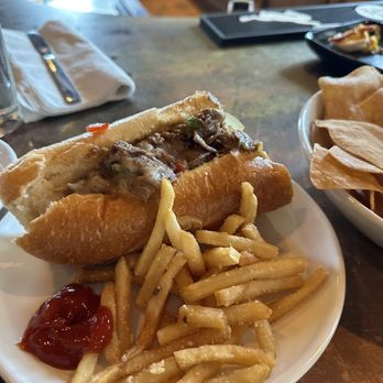 CLOCK Restoration - Philly Cheesesteak Sandwich and fries - Cocktail Bars Near Me - Baltimore, Maryland CLOCK Restoration - Philly Cheesesteak Sandwich and fries - Cocktail Bars Near Me - Baltimore, Maryland