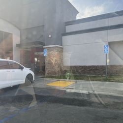 Carl's Jr - Waiting 12 min outside for my food after I got told to park.