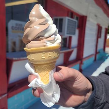 Frosty Chalet - a hand holding a cone of ice cream - Burgers Near Me - Lone Pine, California