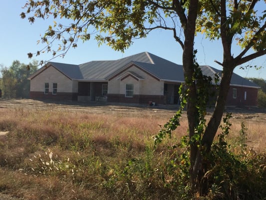 Tague Design Roofing Logo