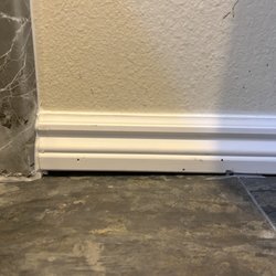 Re-Bath - The work is messy and the baseboard is above the floor.