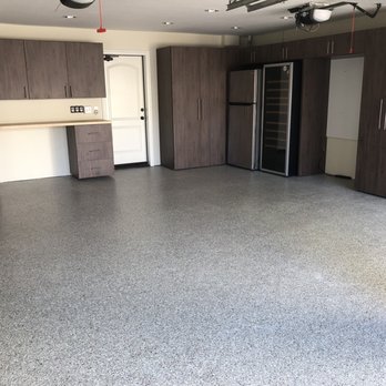 Restore Design Garages - Excellent custom work around refrigerators and a vacuum container in the corner. - Flooring Near Me - Mission Viejo, California