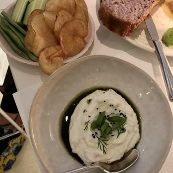 abcV - Shallot labneh with spearmint oil, nigella, romao beans, cucumber, and potato chips - Vegetarian Near Me - New York, New York abcV - Shallot labneh with spearmint oil, nigella, romao beans, cucumber, and potato chips - Vegetarian Near Me - New York, New York