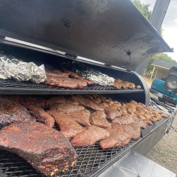 Uncle Papa’s BBQ - a grill full of meat - Caterers Near Me
