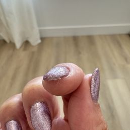 Thick nail polish with cotton stuck inside it Thick nail polish with cotton stuck inside it