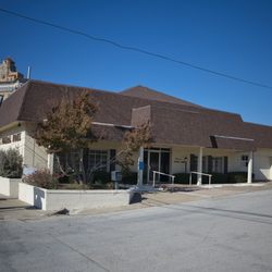 White's Funeral Home - East side and office entrance. Baker Hotel in the background.