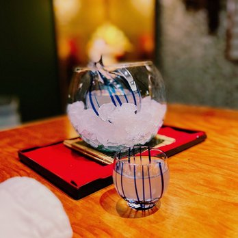 Kaiseki Yu-zen Hashimoto - a fish in a glass bowl on a wooden table - Japanese Near Me - Toronto, Ontario Kaiseki Yu-zen Hashimoto - a fish in a glass bowl on a wooden table - Japanese Near Me - Toronto, Ontario