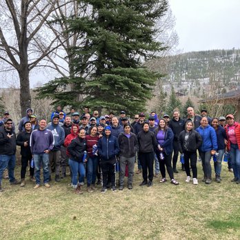 Ethos Landscaping - a group of people standing in front of a tree - Landscaping Near Me - Avon, Colorado
