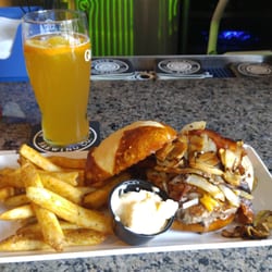 220 House Restaurant - Pretzel burger, cheddar cheese, sauteed onions, mushrooms, and bacon. Delicious