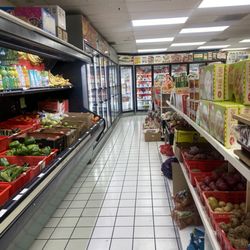 Nilgiris Cash And Carry - Produce front, refrigerated/frozen foods rear.