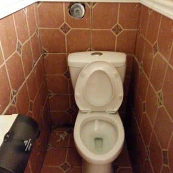Hacienda Las Glorias - This photo was taken with night settings.  It was actual very dark and dirty in this single stall with no door. - Mexican Near Me - Cedar Rapids, Iowa